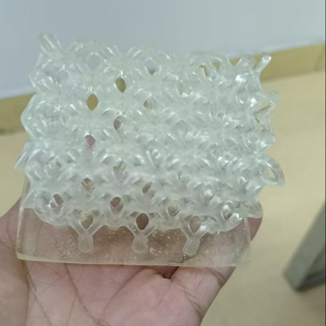 UVU6203-3D is a two-component (A/B) dual-cure aliphatic polyurethane polyurea methacrylate elastomer resin for DLP/LCD 3D printing. It offers high precision, low viscosity, no NCO or organotin, low odor, light color, excellent toughness, tensile strength, tear resistance, flexibility, elongation at break, moderate elasticity, photosensitivity, and wear resistance.